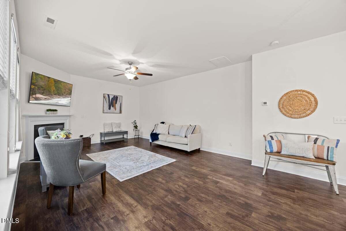 917 Stable Fern Drive Fuquay-Varina, NC 27526 - Photo 14 of 31 a view of a dining room with furniture and chandelier