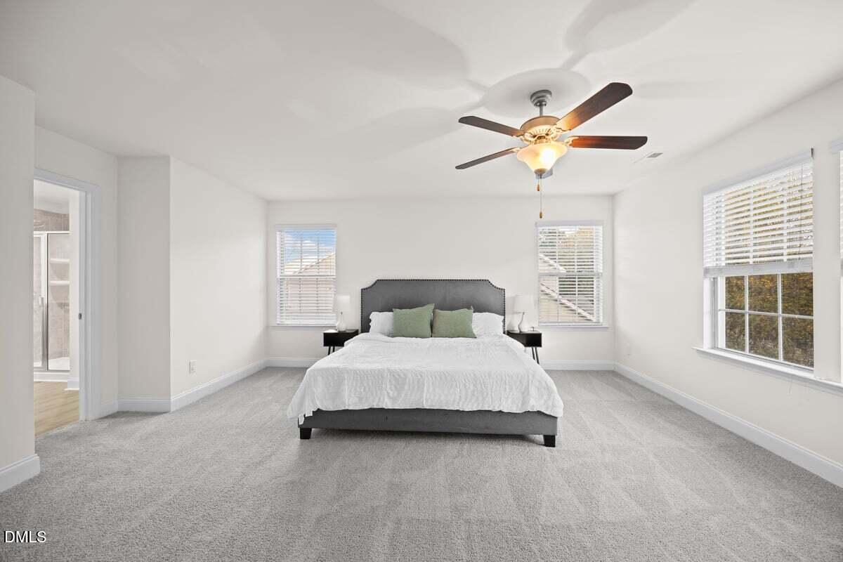 917 Stable Fern Drive Fuquay-Varina, NC 27526 - Photo 16 of 31 a bedroom with a bed and window