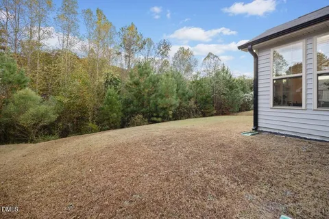 a view of a backyard of the house