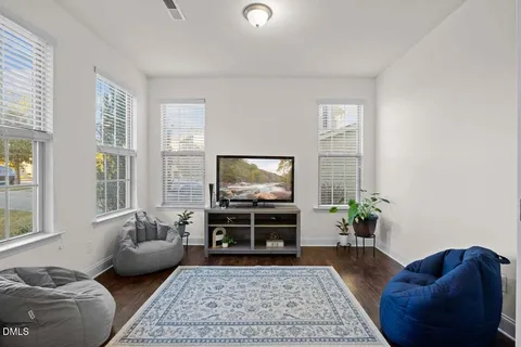a living room with furniture or couch and a flat screen tv