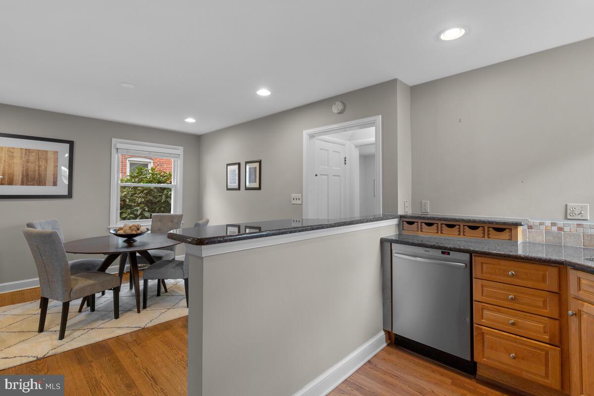 8402 Cedar Street Silver Spring, MD 20910 - Photo 14 of 41 The kitchen peninsula opens to the dining room