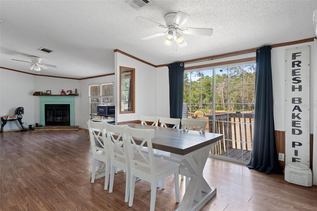 4059 McKethan Road Dade City, FL 33523 - Photo 7 of 50 a view of a dining room with furniture window and wooden floor