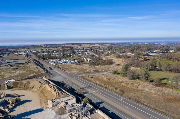 an aerial view of residential houses with city view