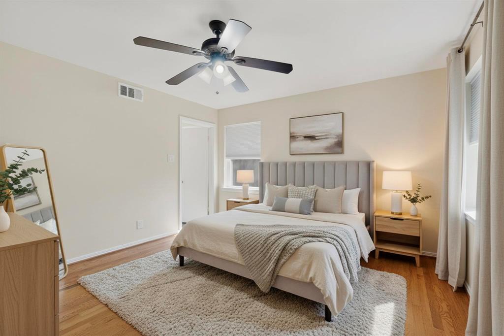 2120 Healey Drive Dallas, TX 75228 - Photo 26 of 39 a bedroom with a bed and a chandelier