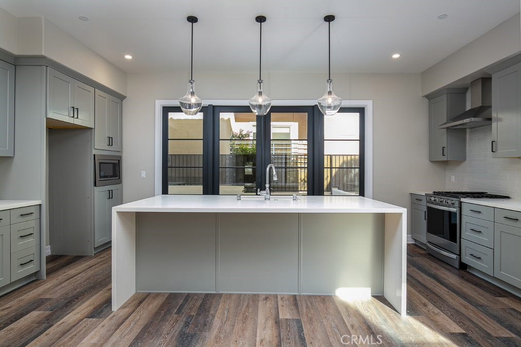 623 Fairview Avenue, Unit A Arcadia, CA 91007 - Photo 1 of 1 a kitchen with kitchen island a counter top space a sink stainless steel appliances and cabinets