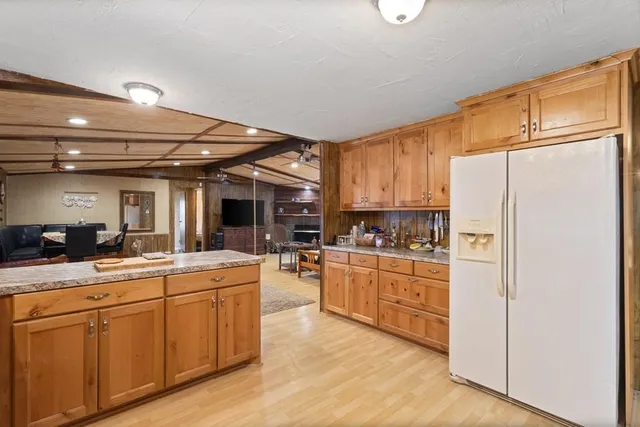 a kitchen with refrigerator cabinets and furniture