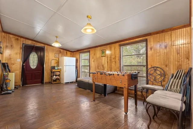 a view of a room with furniture and a large window