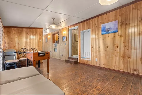a view of a livingroom with furniture and a window