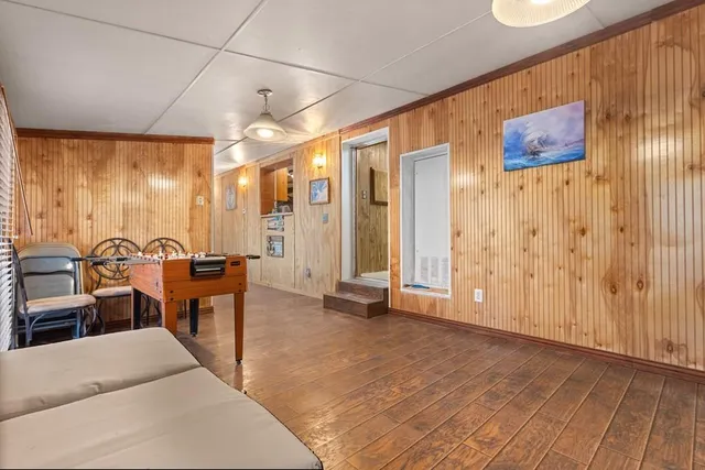 a view of a livingroom with furniture and a window