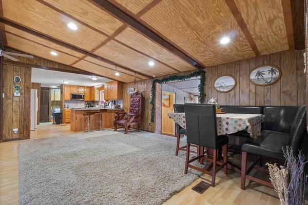 a view of a hallway with seating area and furniture