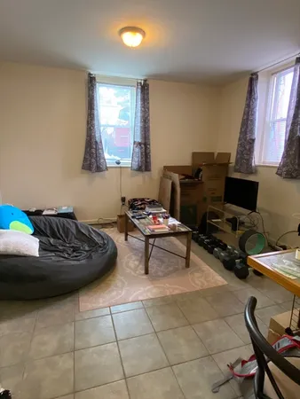 a living room with furniture and a work place area