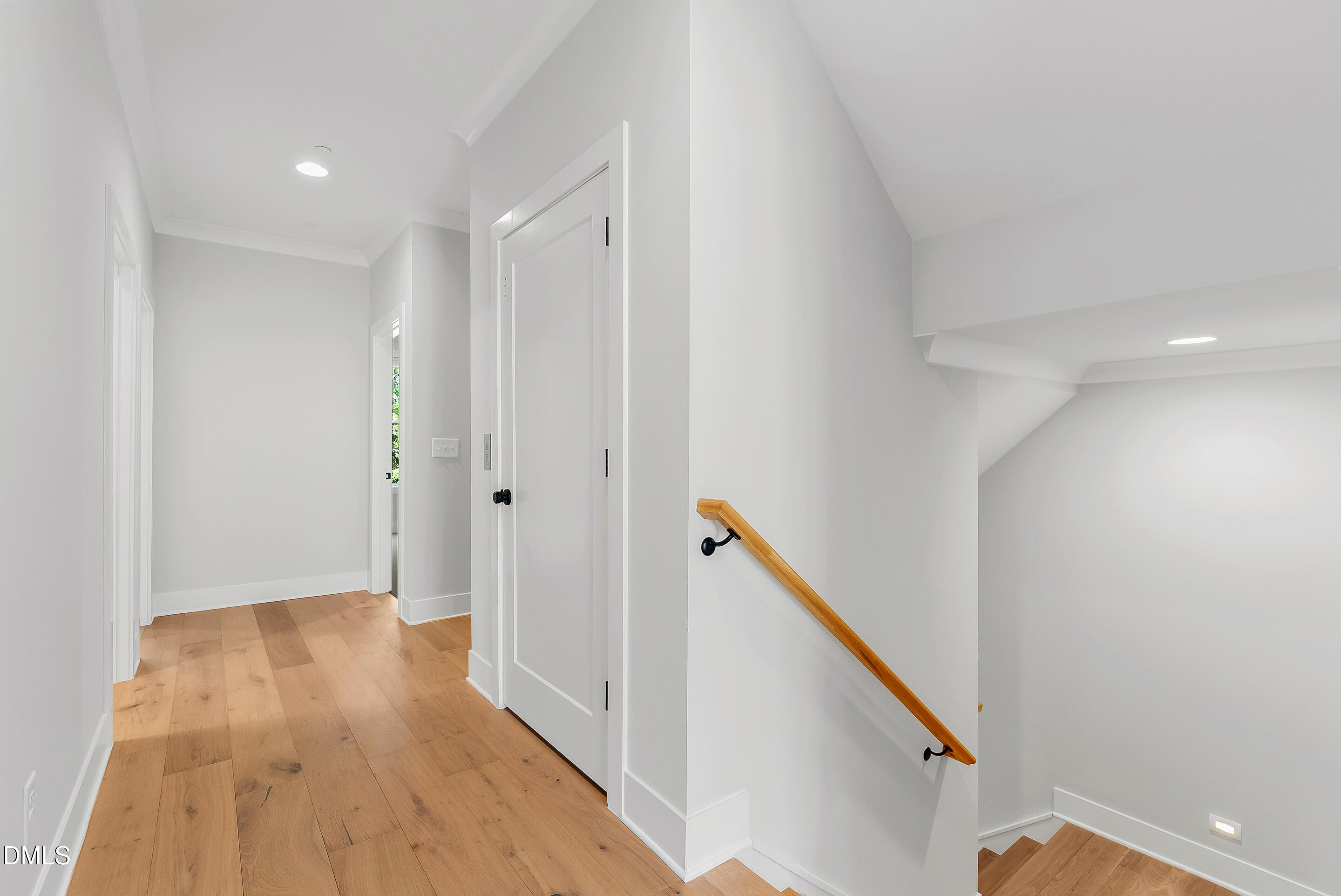 811 Maple Berry Lane, Unit 103 Raleigh, NC 27607 - Photo 29 of 59 a view of hallway with wooden floor