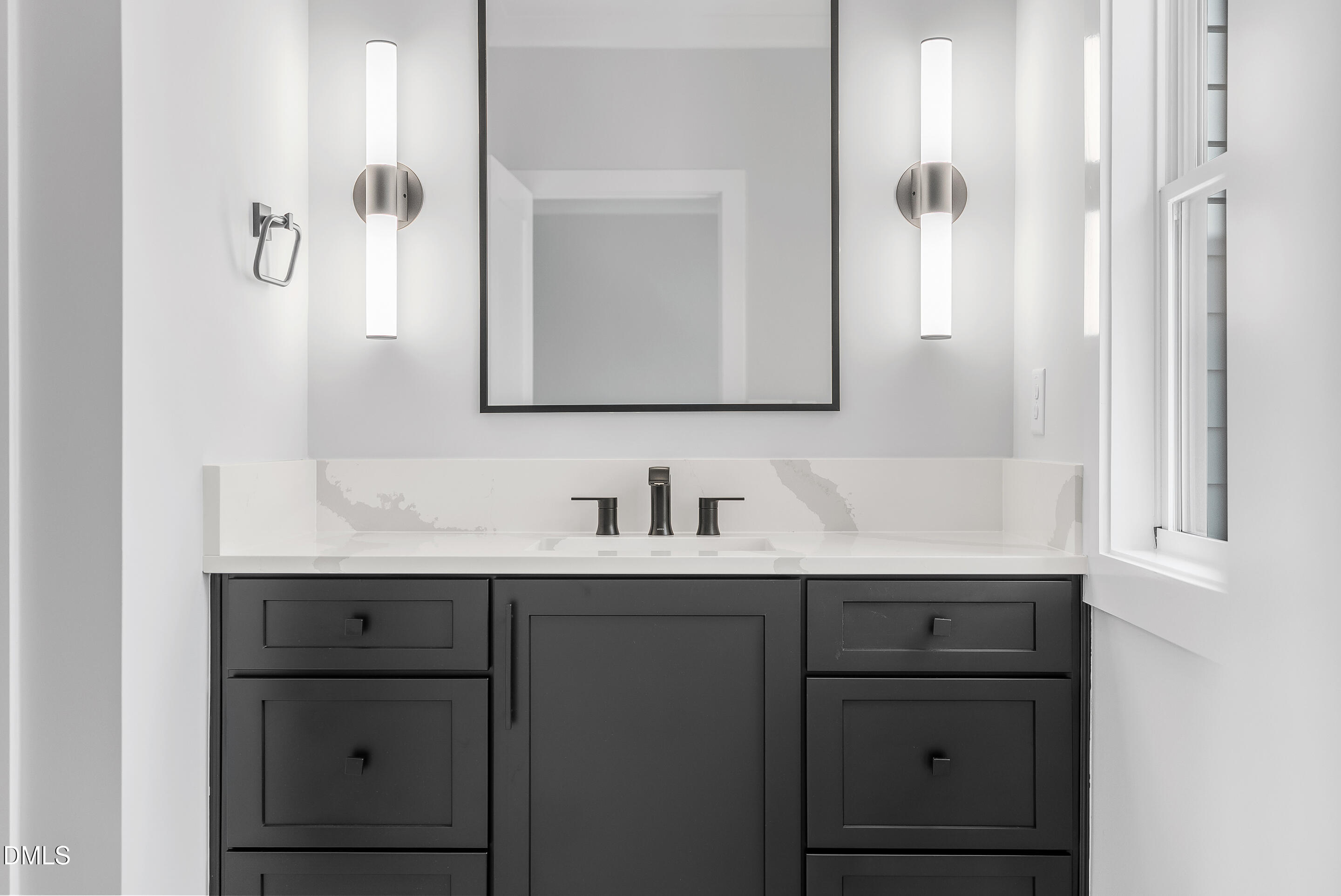 811 Maple Berry Lane, Unit 103 Raleigh, NC 27607 - Photo 34 of 59 a bathroom with a sink and a mirror