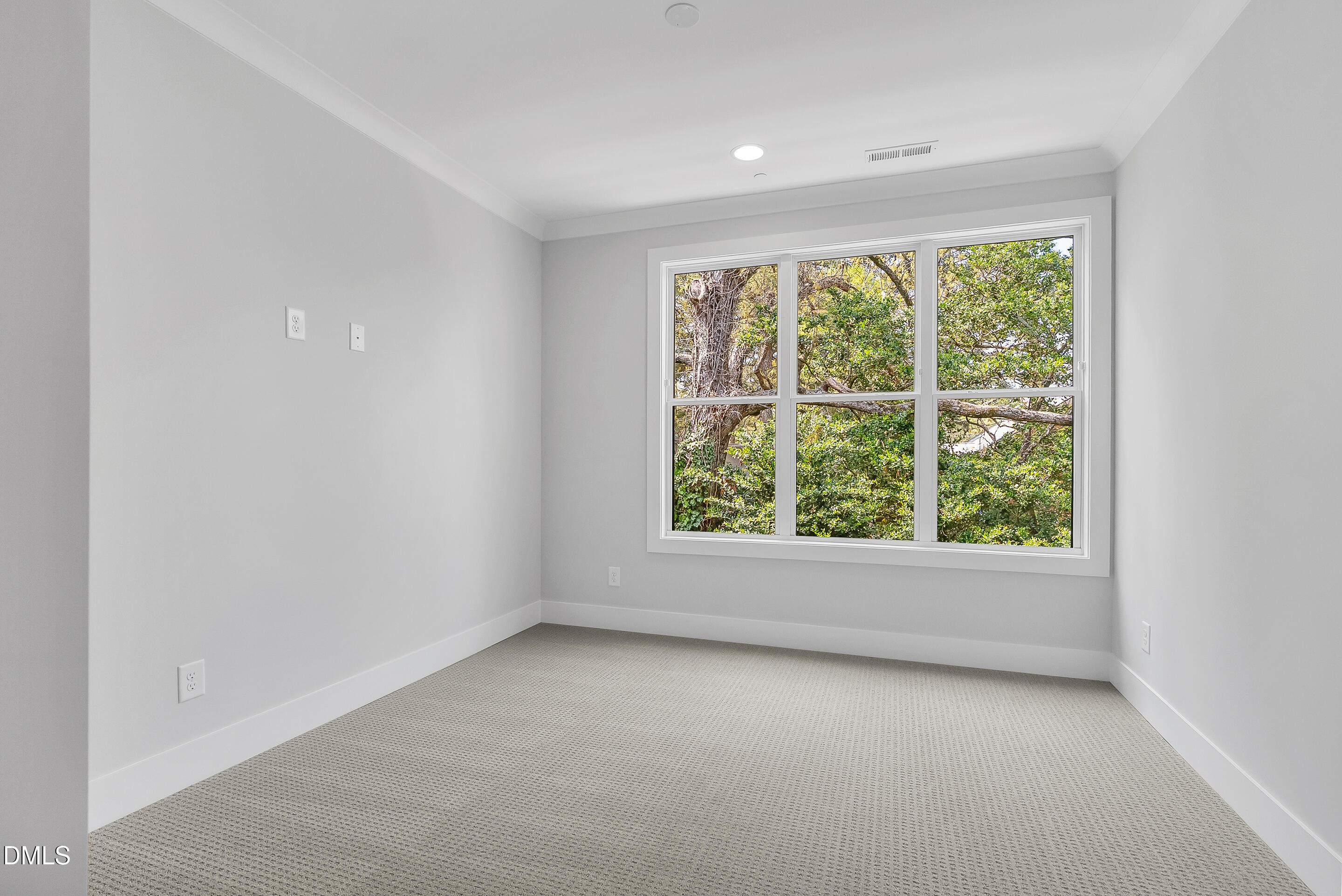 811 Maple Berry Lane, Unit 103 Raleigh, NC 27607 - Photo 36 of 59 an empty room with windows