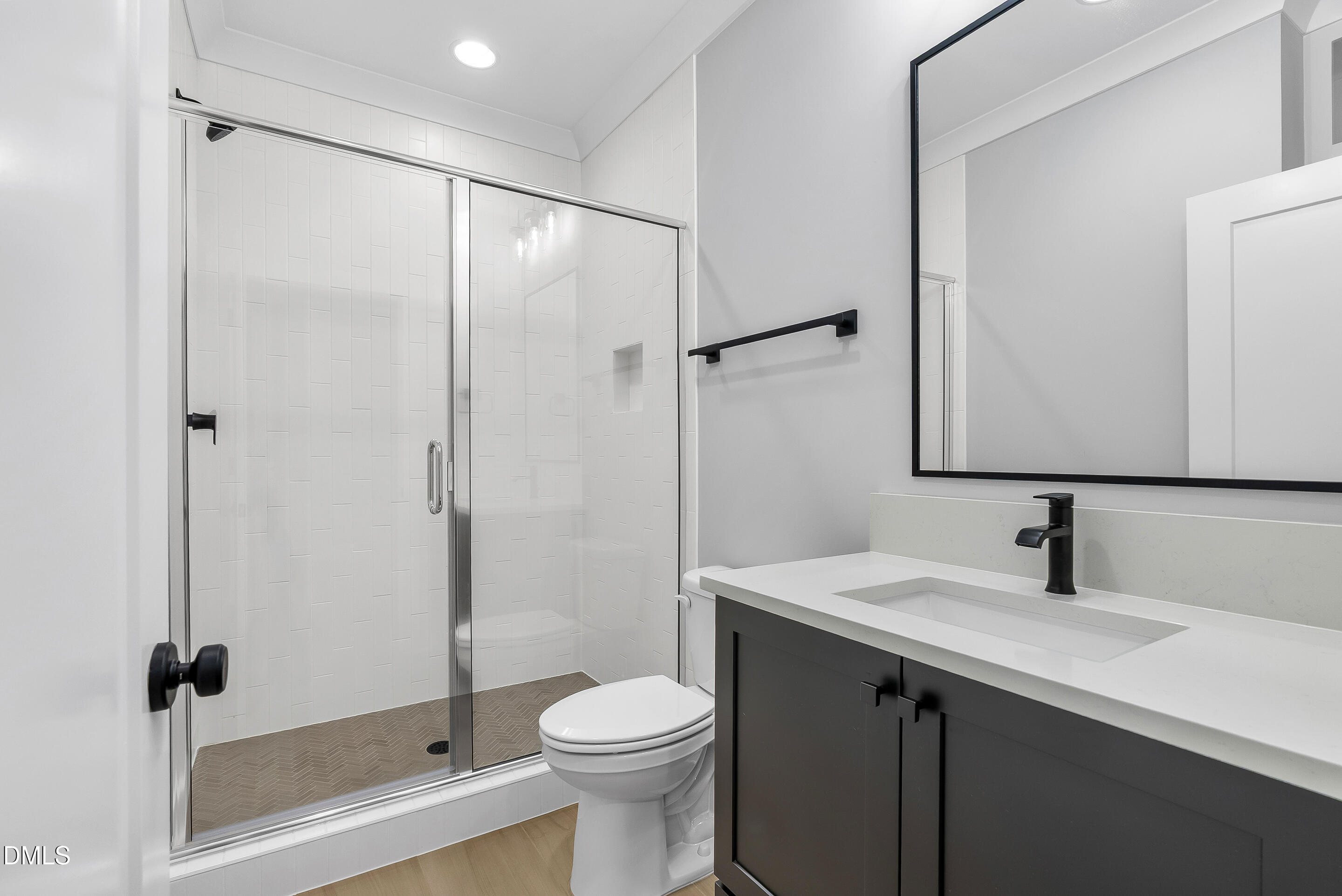 811 Maple Berry Lane, Unit 103 Raleigh, NC 27607 - Photo 46 of 59 a bathroom with a sink toilet and shower
