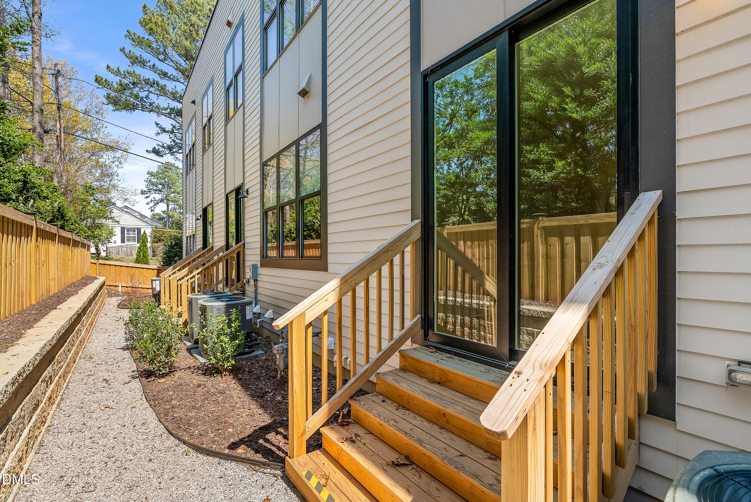 811 Maple Berry Lane, Unit 103 Raleigh, NC 27607 - Photo 54 of 59 a view of a house with backyard and deck