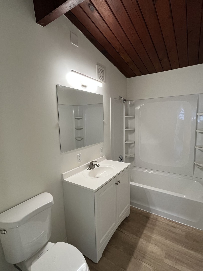 137 Highview Avenue Addison, IL 60101 - Photo 3 of 12 a bathroom with a sink toilet vanity and tub