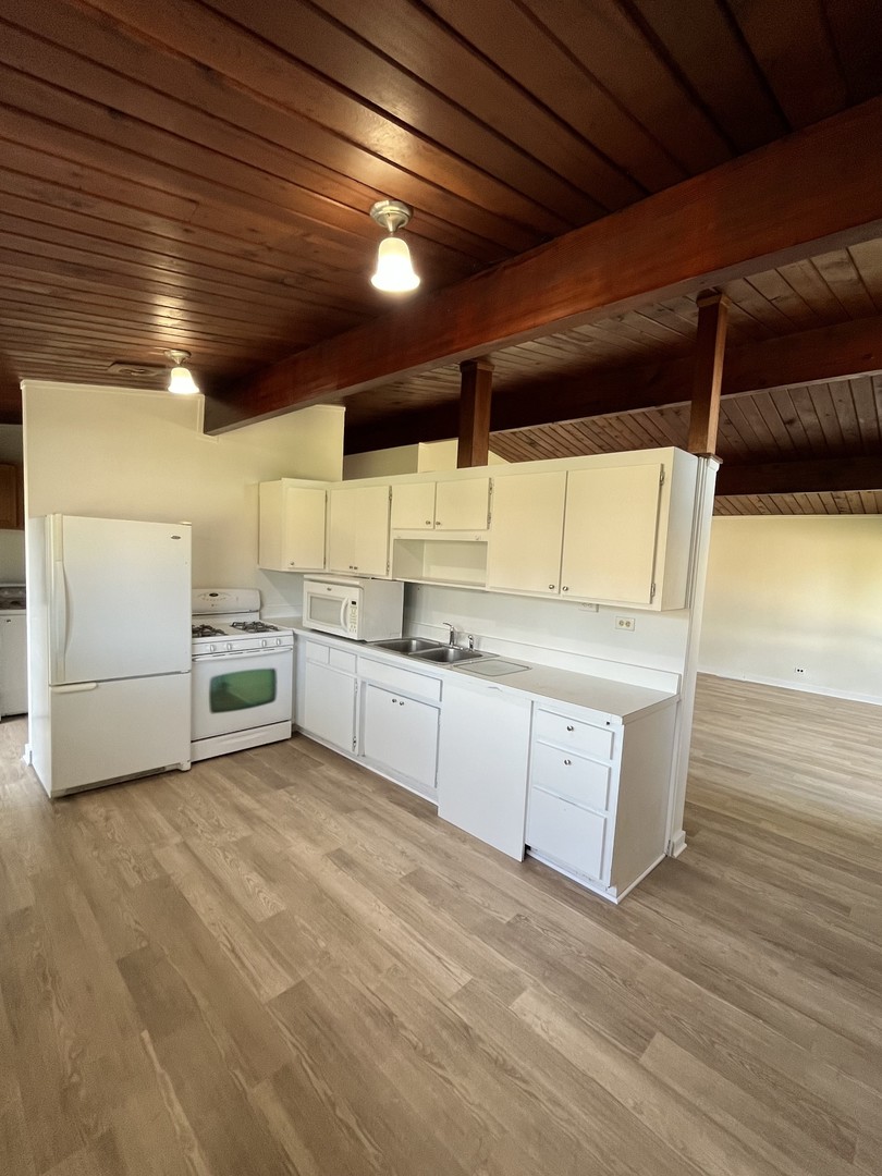 137 Highview Avenue Addison, IL 60101 - Photo 5 of 12 a view of a kitchen with electric appliances