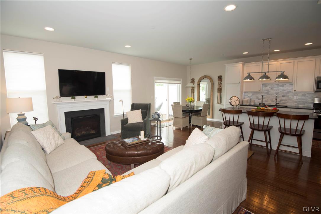 407 Pennycress Road Allentown, PA 18104 - Photo 11 of 34 a living room with furniture a flat screen tv and a fireplace