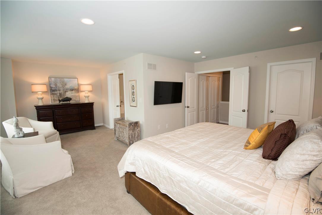 407 Pennycress Road Allentown, PA 18104 - Photo 13 of 34 a bedroom with a bed and a television in it