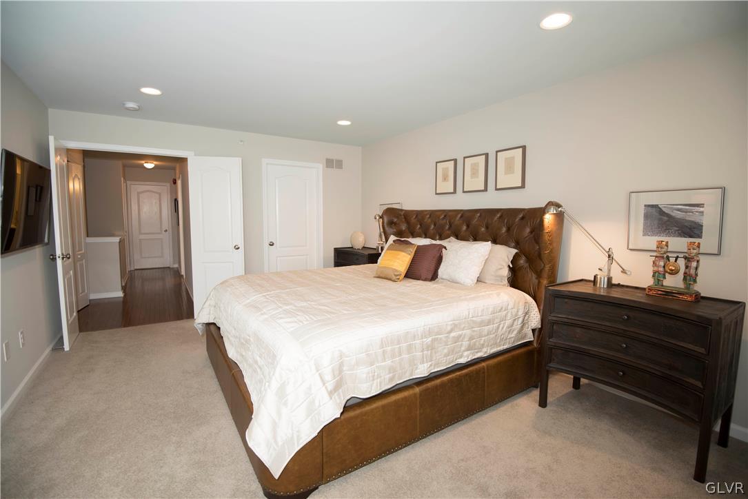 407 Pennycress Road Allentown, PA 18104 - Photo 14 of 34 a bed room with a bed and a night stand