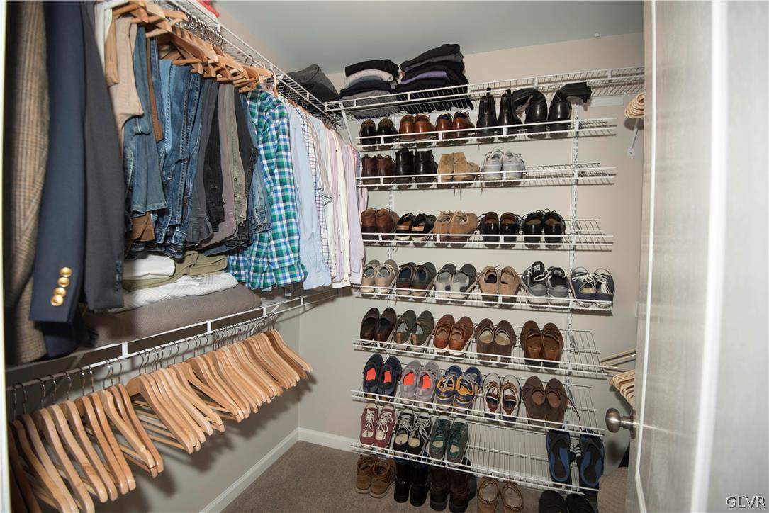 407 Pennycress Road Allentown, PA 18104 - Photo 18 of 34 a view of walk in closet with clothes and shoes