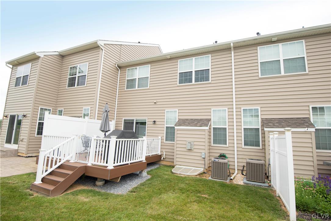 407 Pennycress Road Allentown, PA 18104 - Photo 32 of 34 a view of a house with a deck and a yard