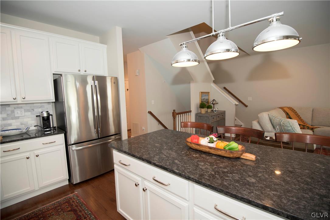 407 Pennycress Road Allentown, PA 18104 - Photo 9 of 34 a kitchen with a refrigerator and countertop