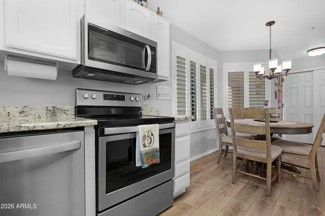 a kitchen with a stove and a microwave