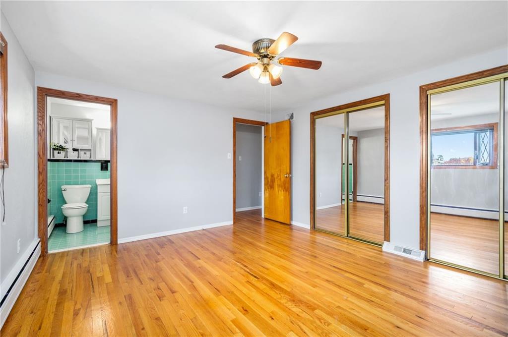 938 McCoy Road McKees Rocks, PA 15136 - Photo 12 of 24 a view of an empty room with wooden floor and a window