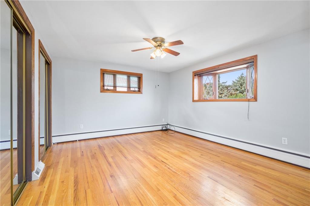 938 McCoy Road McKees Rocks, PA 15136 - Photo 13 of 24 a view of an empty room with wooden floor and a window