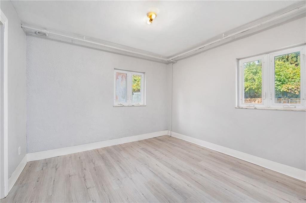 938 McCoy Road McKees Rocks, PA 15136 - Photo 15 of 24 wooden floor in an empty room with a window