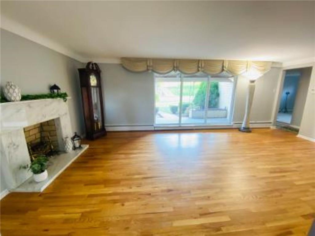 938 McCoy Road McKees Rocks, PA 15136 - Photo 3 of 24 a view of a living room with furniture and a fireplace