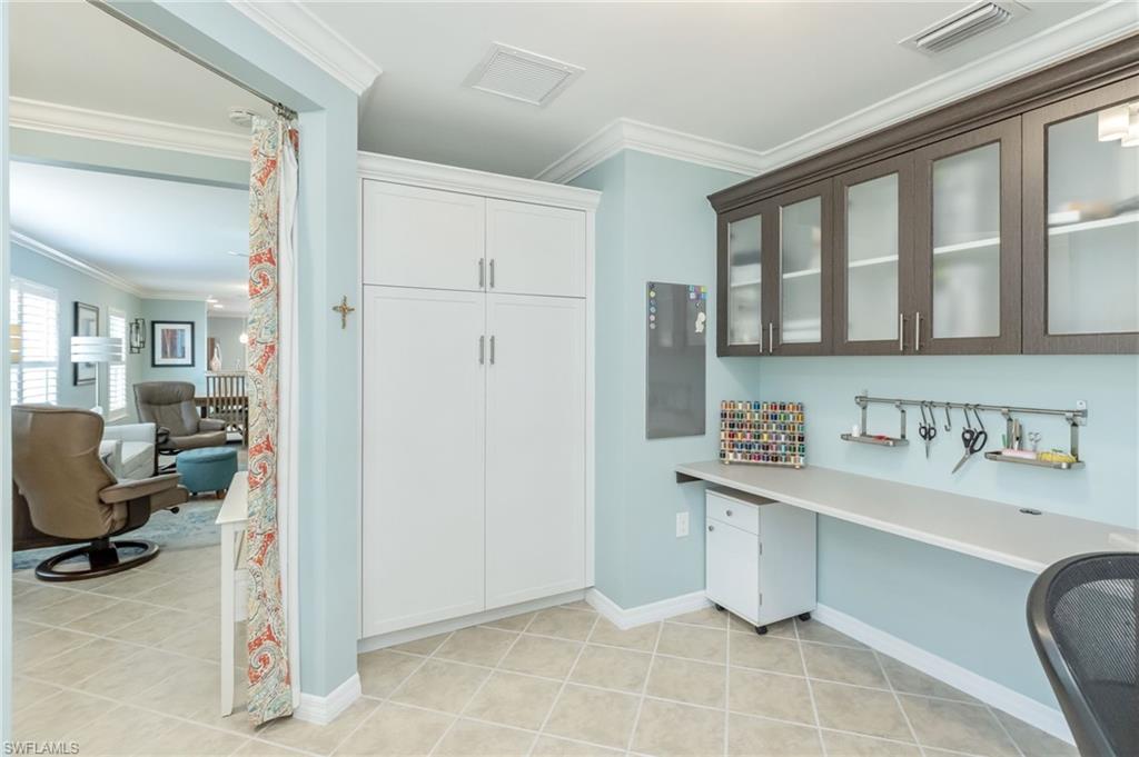 5801 Declaration Court Ave Maria, FL 34142 - Photo 12 of 38 a view of a kitchen with fridge and workspace
