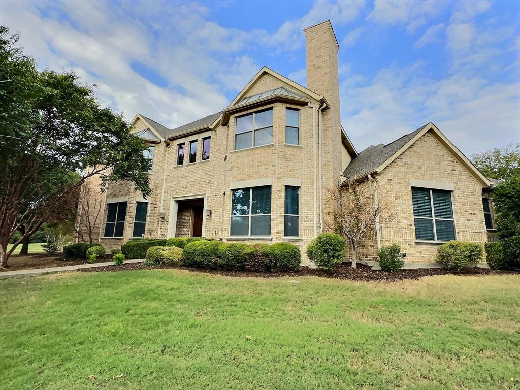 671 Lakeridge Drive Fairview, TX 75069 - Photo 1 of 1 a front view of a house with garden