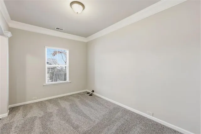 a kitchen with stainless steel appliances granite countertop a refrigerator a sink dishwasher a stove and white cabinets with wooden floor