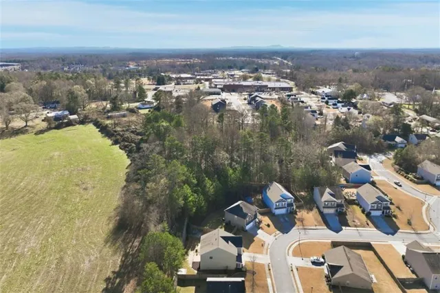 an aerial view of a house with outdoor space