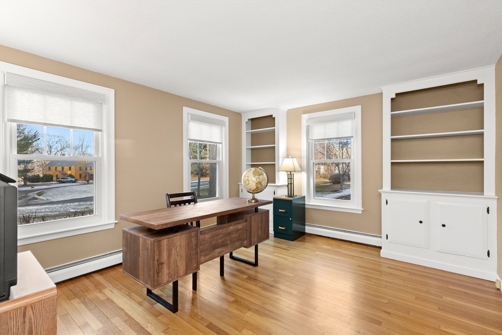 32 Alderbrook Drive Topsfield, MA 01983 - Photo 13 of 40 a view of a livingroom with furniture window and wooden floor