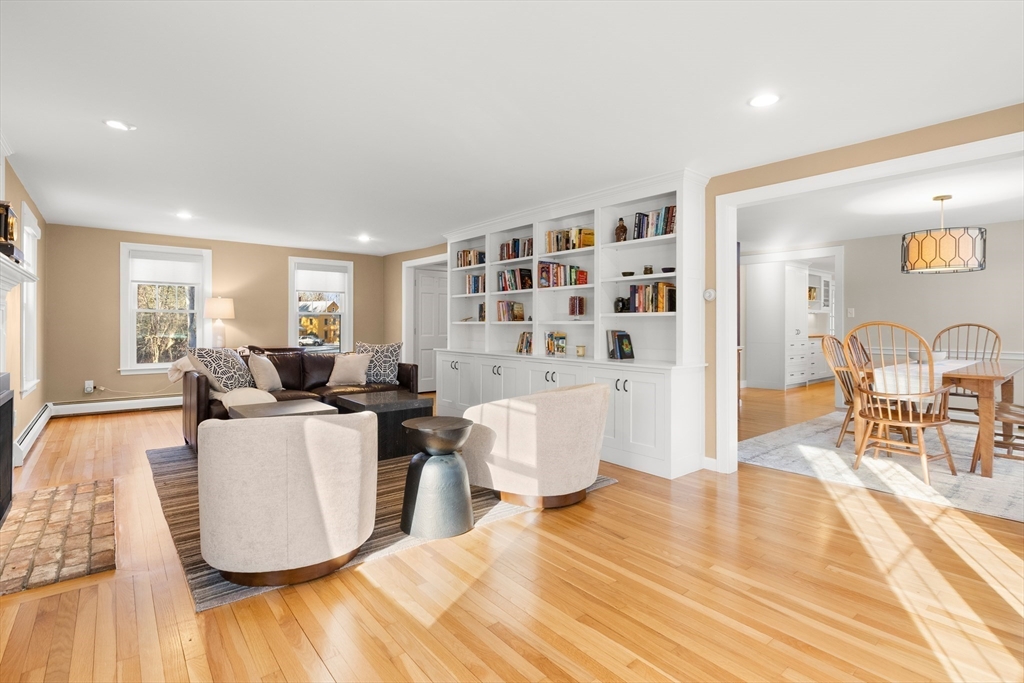 32 Alderbrook Drive Topsfield, MA 01983 - Photo 15 of 40 a living room with furniture a dining table and a large window