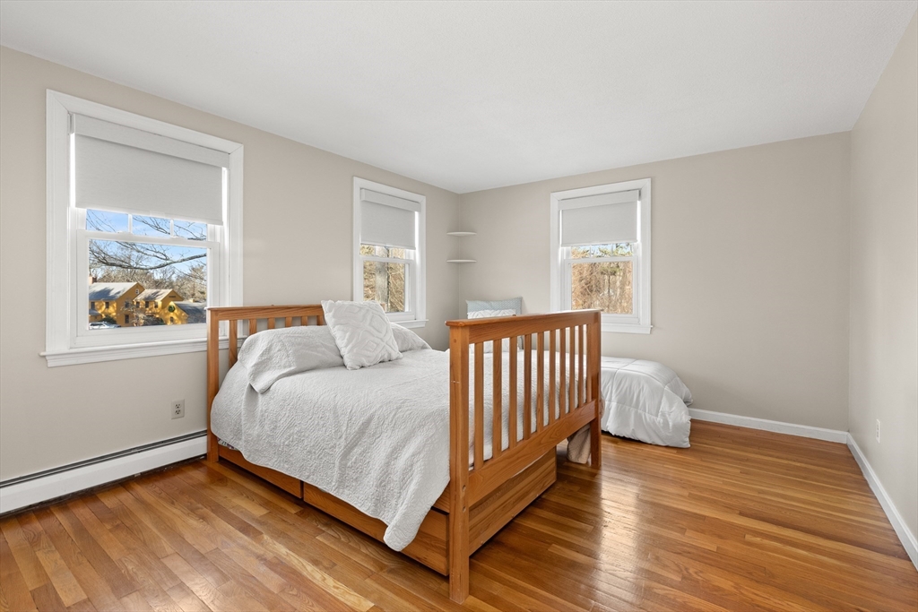 32 Alderbrook Drive Topsfield, MA 01983 - Photo 18 of 40 a bed sitting in a bedroom next to a window
