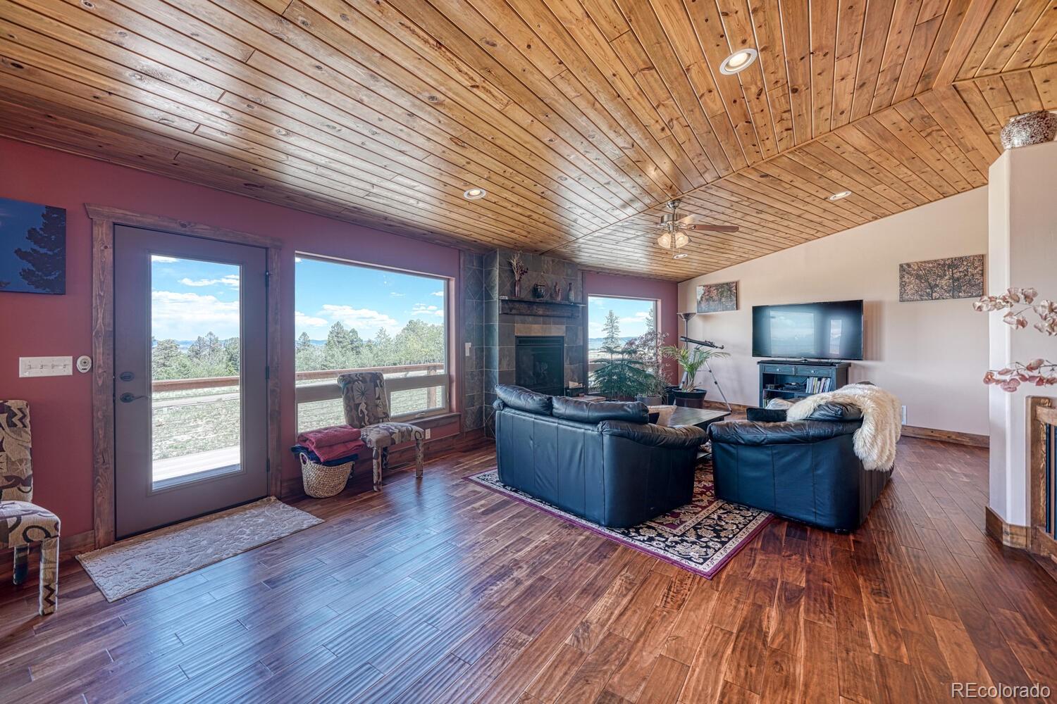 441 Kaufman Road Hartsel, CO 80449 - Photo 12 of 50 a living room with furniture and wooden floor