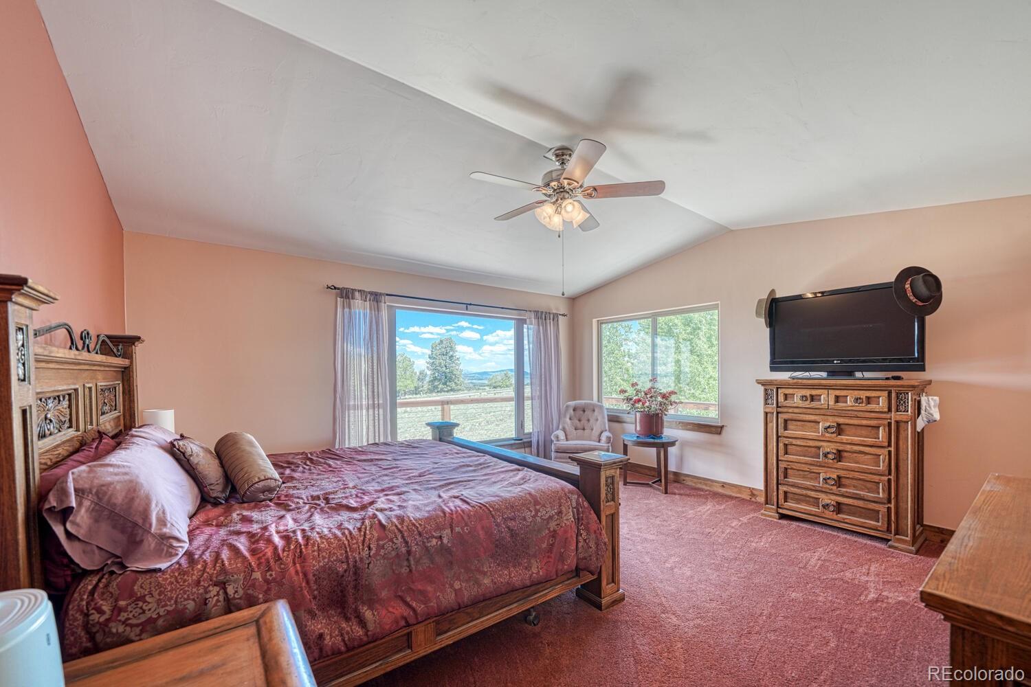441 Kaufman Road Hartsel, CO 80449 - Photo 14 of 50 a spacious bedroom with a bed and furniture