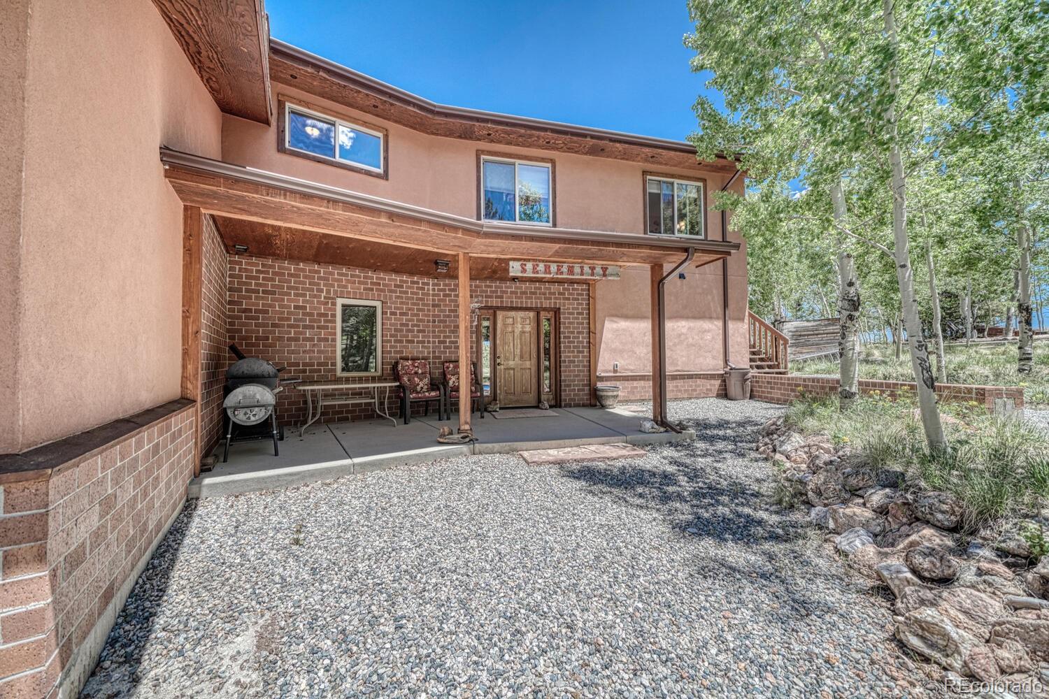 441 Kaufman Road Hartsel, CO 80449 - Photo 2 of 50 a view of a house with a backyard and chairs