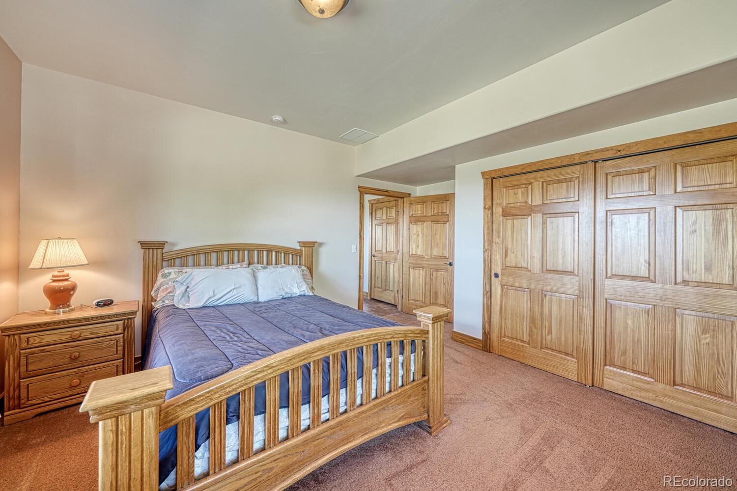 441 Kaufman Road Hartsel, CO 80449 - Photo 24 of 50 a bedroom with a bed and a window