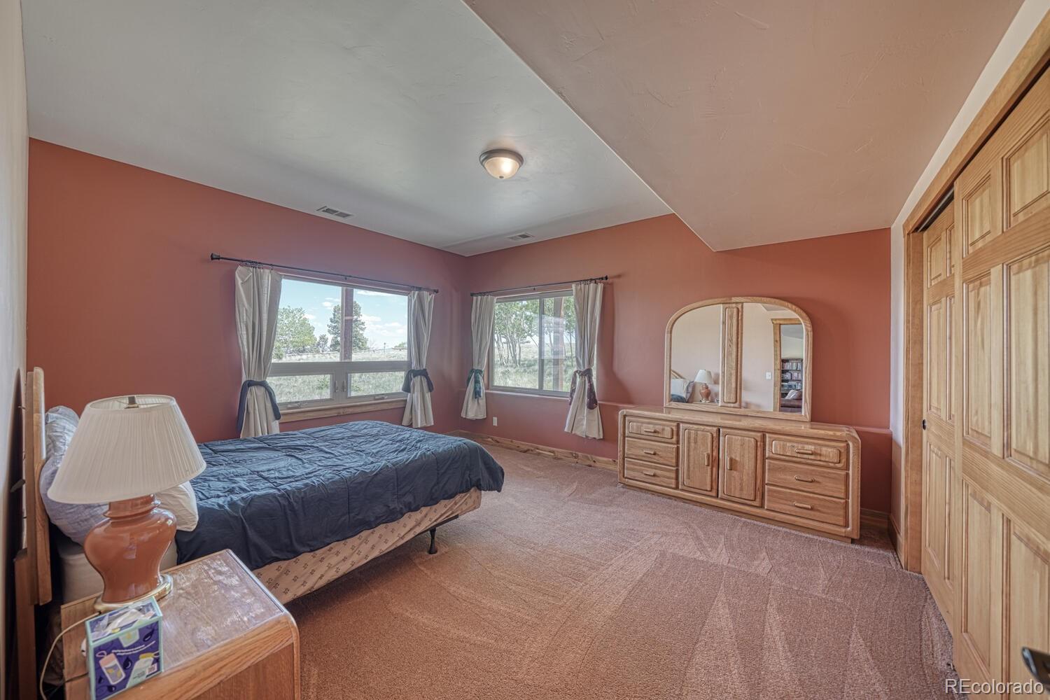 441 Kaufman Road Hartsel, CO 80449 - Photo 27 of 50 a bedroom with a bed and window