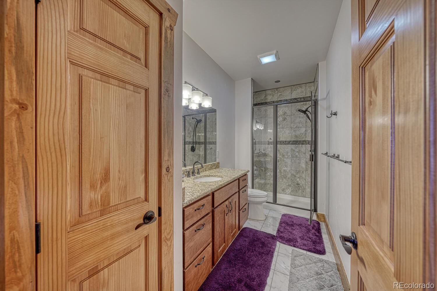 441 Kaufman Road Hartsel, CO 80449 - Photo 28 of 50 a bathroom with a vanity and a shower