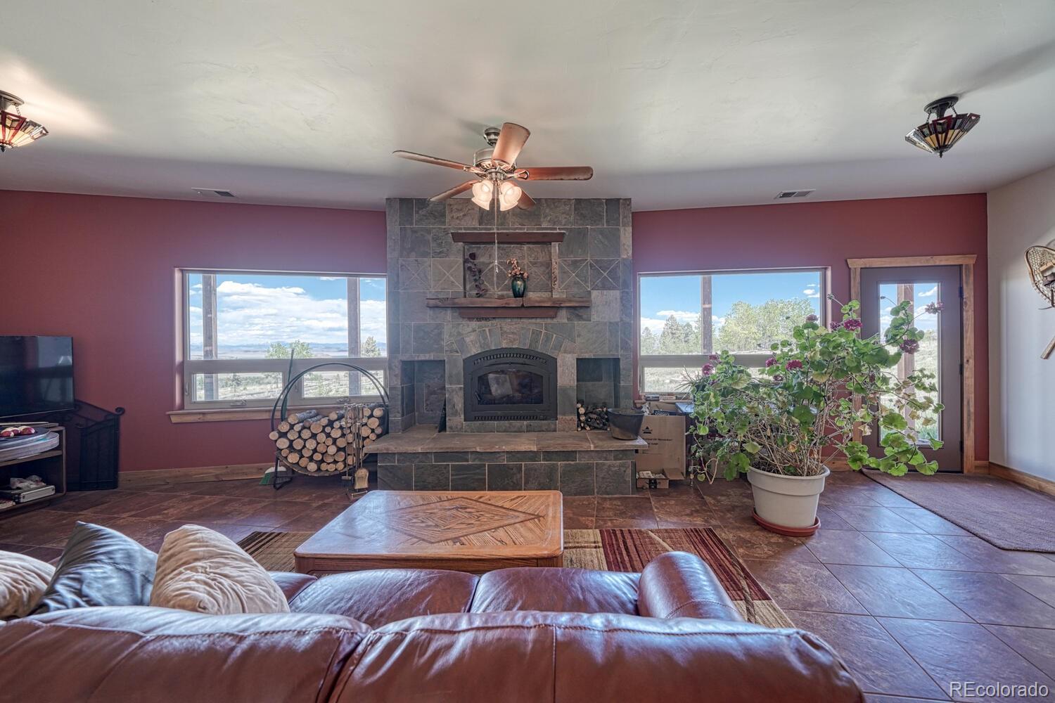 441 Kaufman Road Hartsel, CO 80449 - Photo 31 of 50 a living room with furniture and a fireplace