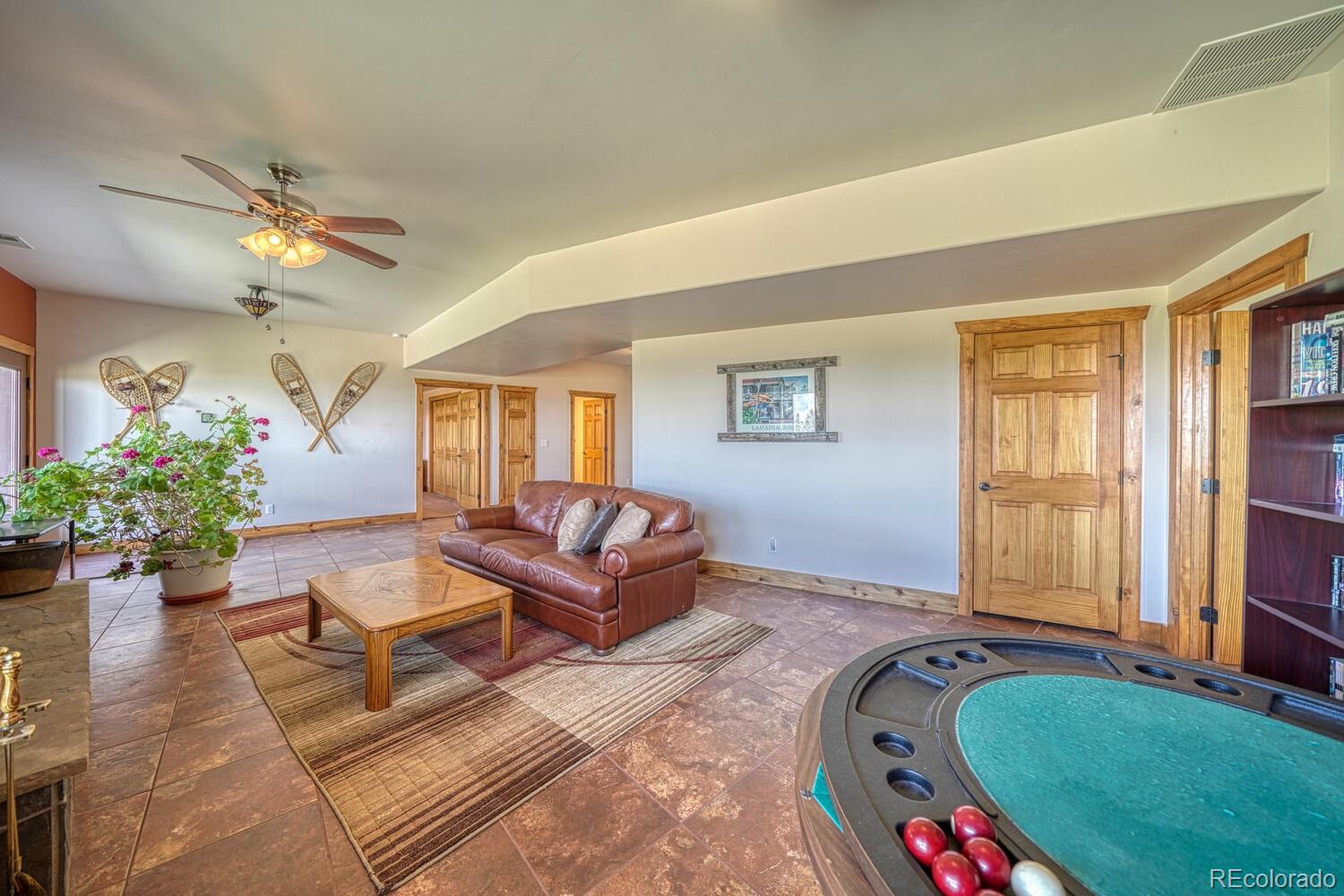 441 Kaufman Road Hartsel, CO 80449 - Photo 32 of 50 a living room with furniture and a potted plant
