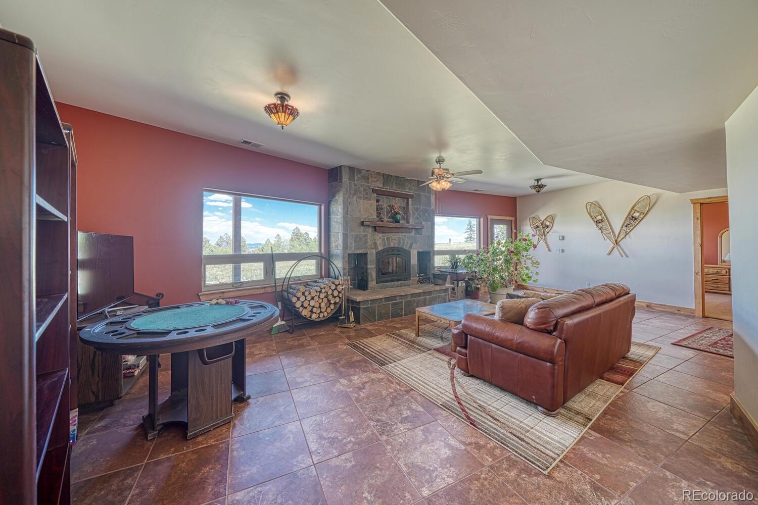 441 Kaufman Road Hartsel, CO 80449 - Photo 33 of 50 a living room with furniture and a fireplace