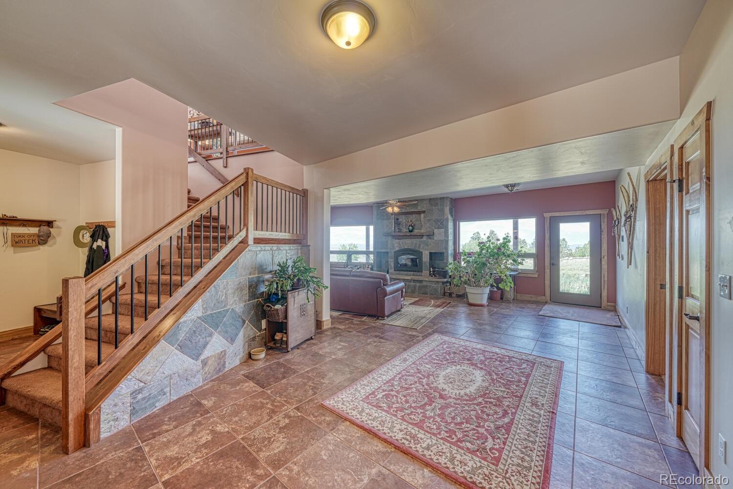 441 Kaufman Road Hartsel, CO 80449 - Photo 36 of 50 a living room with furniture and a rug